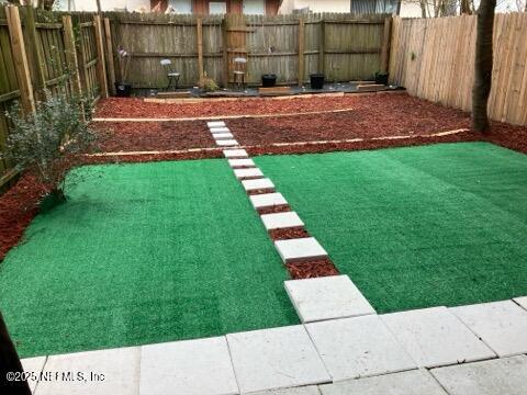 view of yard featuring a fenced backyard