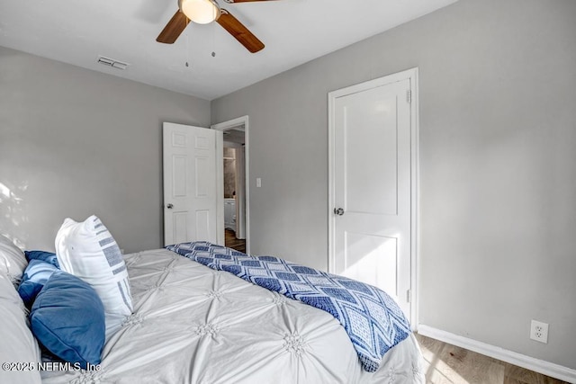 bedroom with hardwood / wood-style flooring and ceiling fan