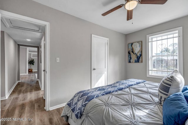 bedroom with hardwood / wood-style flooring and ceiling fan