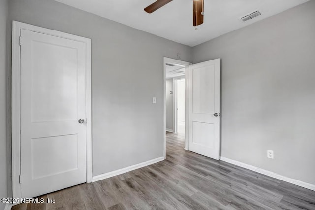 unfurnished bedroom with light hardwood / wood-style floors and ceiling fan