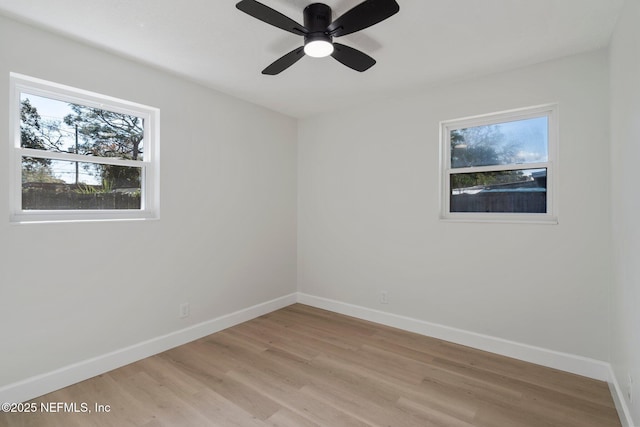 unfurnished room featuring ceiling fan and light hardwood / wood-style flooring