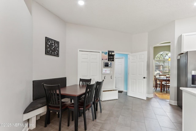 dining space featuring tile patterned floors