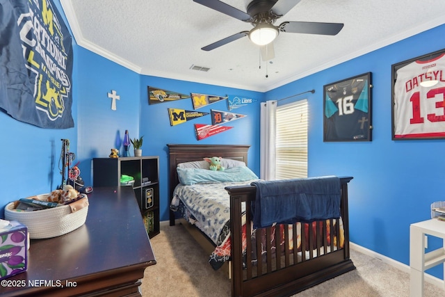 bedroom with ceiling fan, ornamental molding, a textured ceiling, and carpet flooring