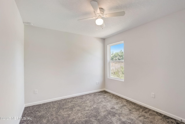 carpeted empty room featuring a textured ceiling and ceiling fan