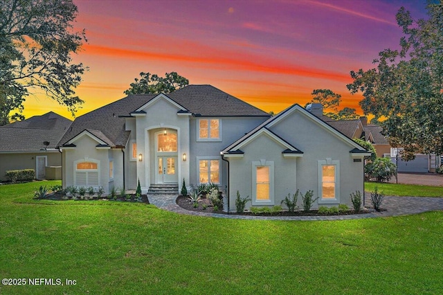 view of front of home featuring a lawn