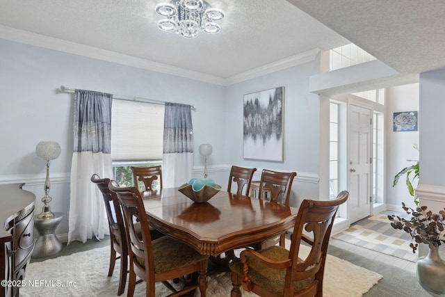 744 Cherry Grove Rd, Orange Park, FL 32073 - dining area with an inviting chandelier, ornamental molding, and a textured ceiling
