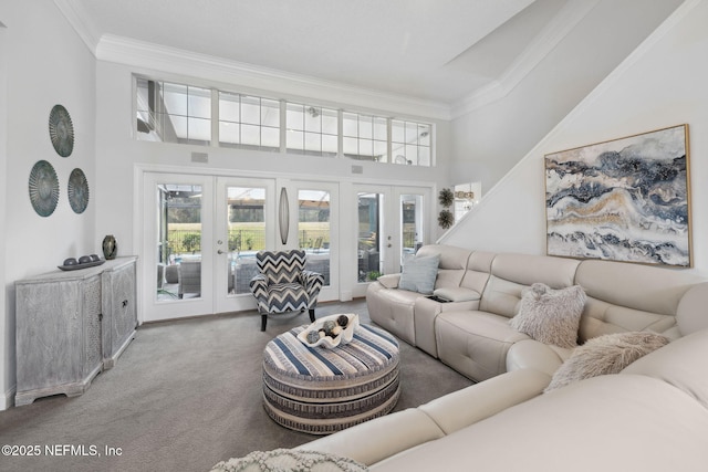 744 Cherry Grove Rd, Orange Park, FL 32073 - carpeted living room featuring ornamental molding, a towering ceiling, and french doors