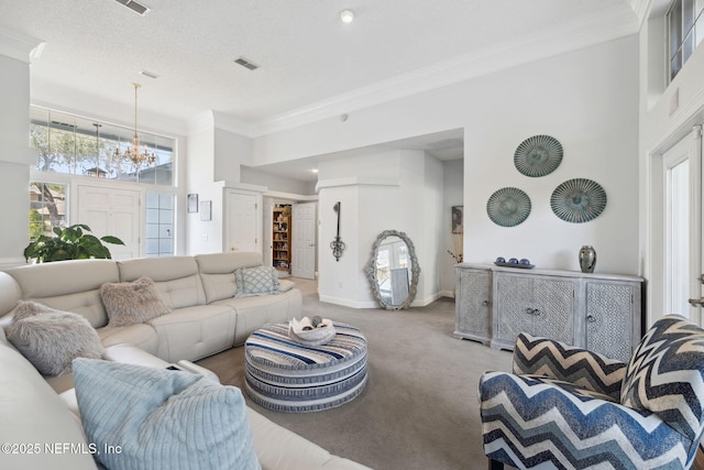 744 Cherry Grove Rd, Orange Park, FL 32073 - living room with a towering ceiling, carpet floors, ornamental molding, and a chandelier