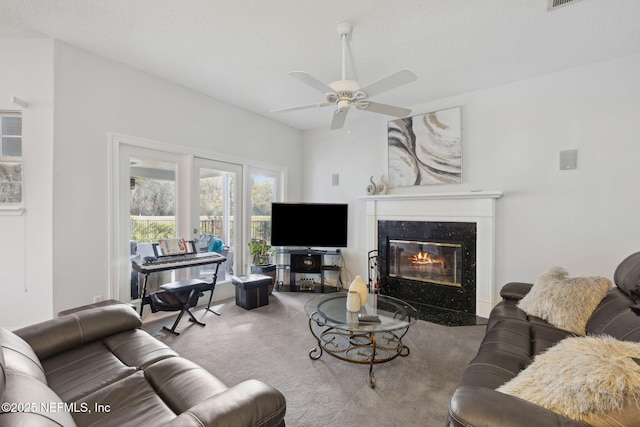 744 Cherry Grove Rd, Orange Park, FL 32073 - carpeted living room with ceiling fan and a high end fireplace