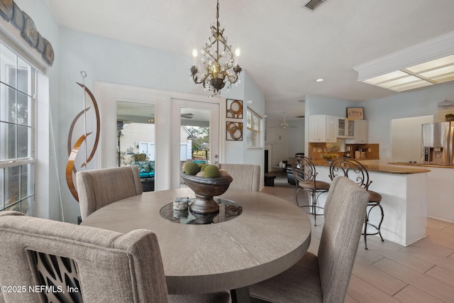 744 Cherry Grove Rd, Orange Park, FL 32073 - dining area with an inviting chandelier and light hardwood / wood-style floors
