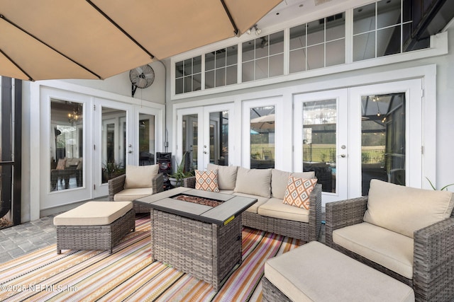 744 Cherry Grove Rd, Orange Park, FL 32073 - exterior space with a patio area, an outdoor living space with a fire pit, and french doors