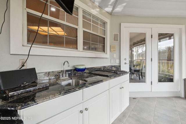 744 Cherry Grove Rd, Orange Park, FL 32073 - bar with white cabinetry, dark stone counters, sink, and light tile patterned floors