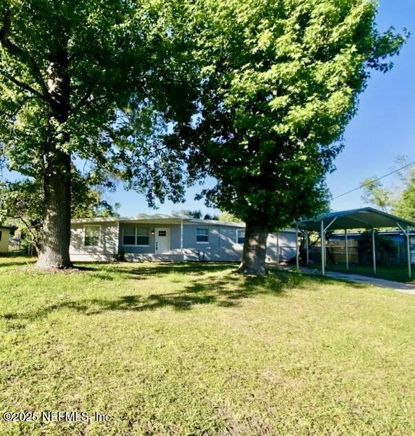 view of yard with a carport