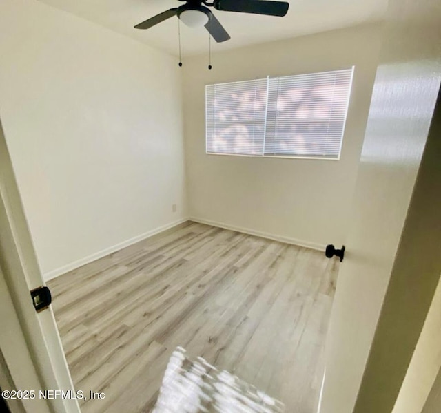 unfurnished room featuring ceiling fan and light hardwood / wood-style flooring