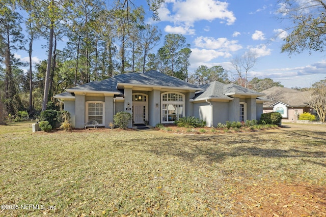 ranch-style home featuring a front lawn