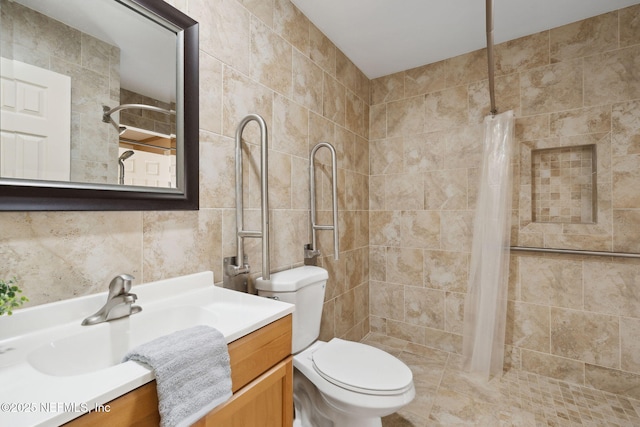 bathroom with vanity, toilet, and curtained shower