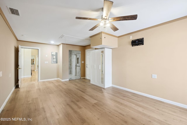 unfurnished room featuring ceiling fan, ornamental molding, and light hardwood / wood-style flooring