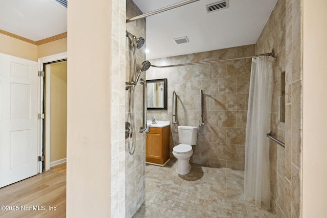 bathroom with toilet, tile walls, ornamental molding, vanity, and a shower with shower curtain