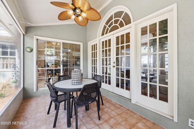 sunroom / solarium featuring french doors, ceiling fan, and lofted ceiling