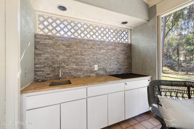 interior space with tile patterned flooring and sink