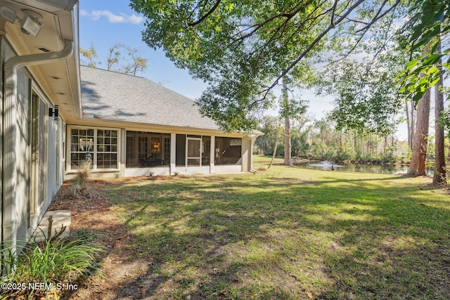 view of yard featuring a sunroom