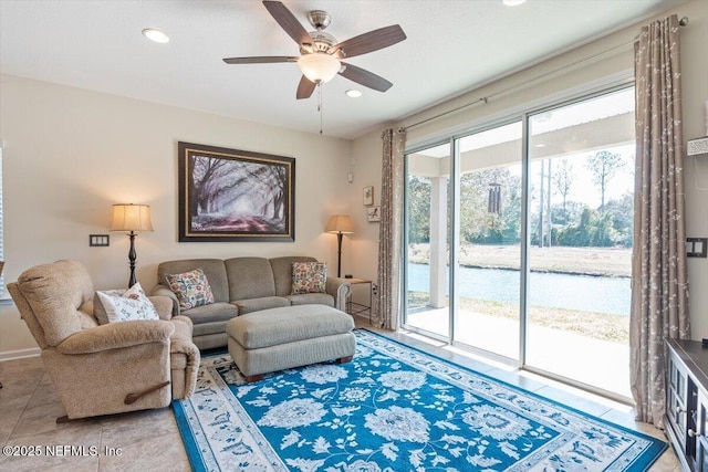 tiled living room featuring ceiling fan