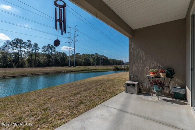 view of patio / terrace with a water view