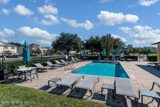 view of swimming pool featuring a patio