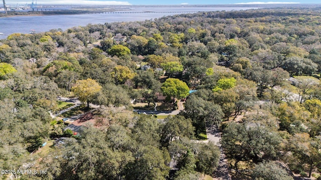 aerial view with a water view and a forest view