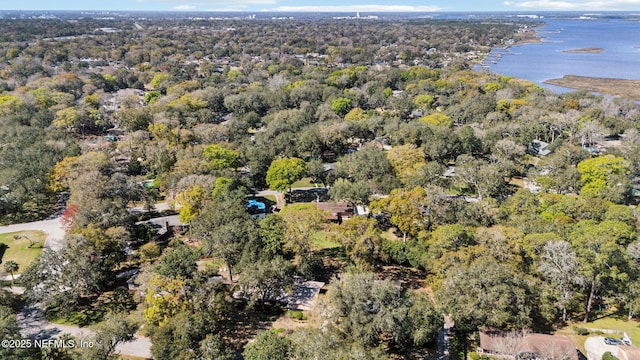 drone / aerial view featuring a water view and a wooded view