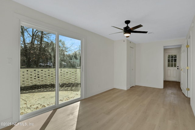 spare room featuring ceiling fan and light wood-type flooring