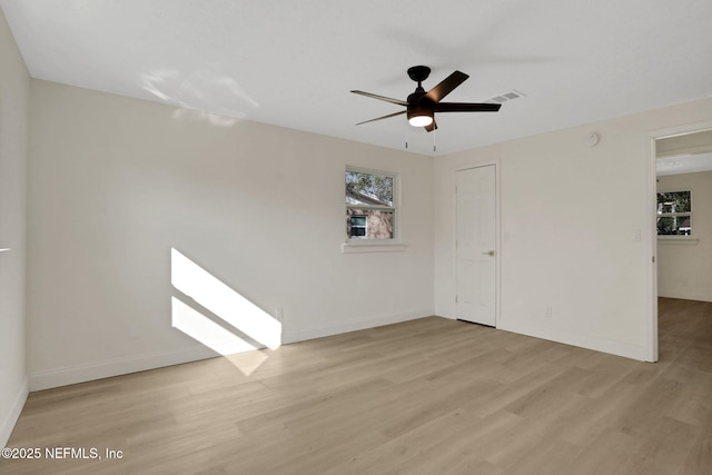 spare room featuring ceiling fan and light wood-type flooring