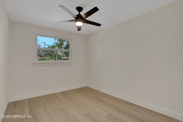 spare room with ceiling fan and light hardwood / wood-style floors