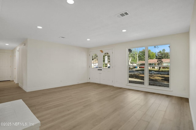 unfurnished room featuring light hardwood / wood-style floors