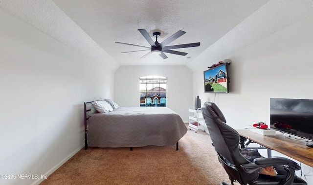 bedroom with lofted ceiling, ceiling fan, a textured ceiling, and carpet