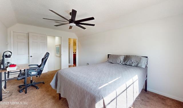 bedroom featuring ceiling fan, lofted ceiling, carpet flooring, and a textured ceiling