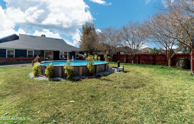 view of yard featuring a fenced in pool