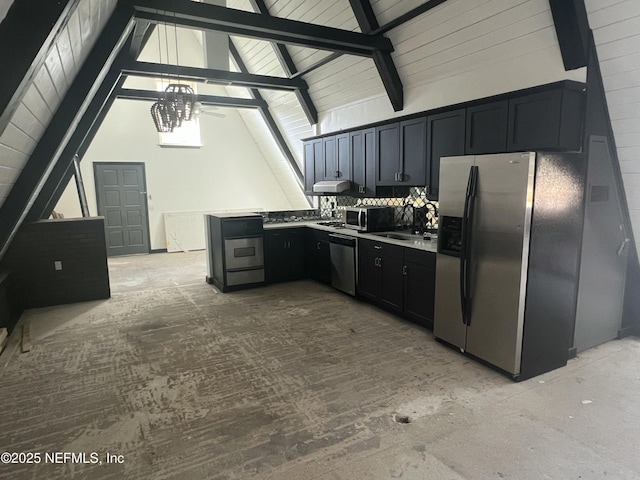 kitchen featuring stainless steel appliances and vaulted ceiling with beams