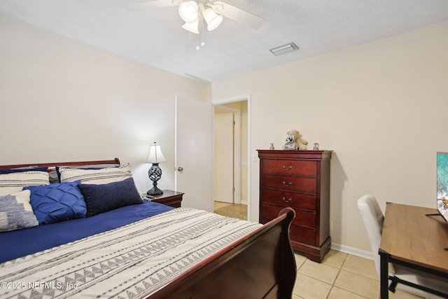 tiled bedroom featuring ceiling fan
