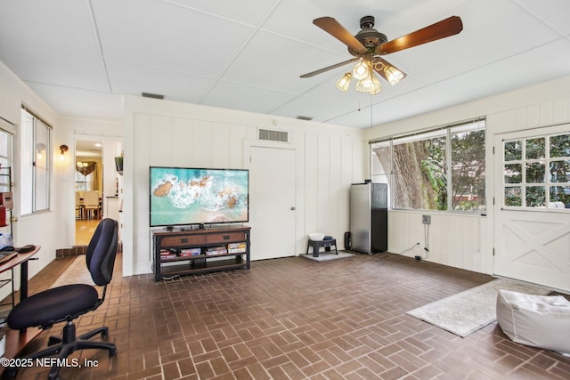 office space with ceiling fan