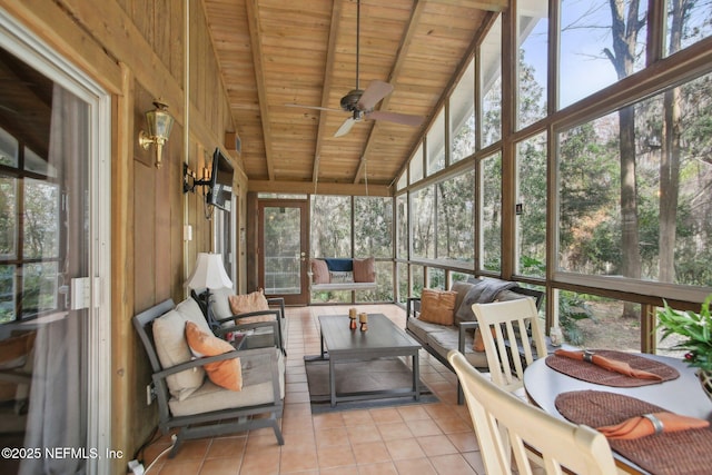 sunroom / solarium featuring wood ceiling, a wealth of natural light, lofted ceiling with beams, and ceiling fan