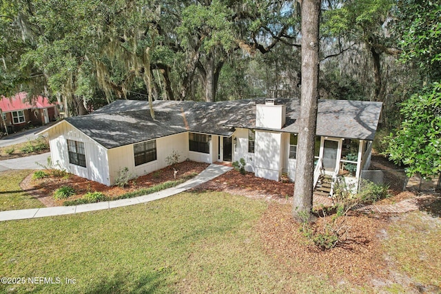 ranch-style home with a front lawn