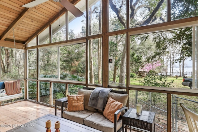 unfurnished sunroom featuring wood ceiling and lofted ceiling with beams