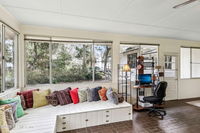 sunroom / solarium with a drop ceiling