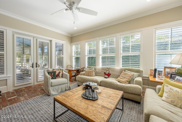 sunroom / solarium featuring ceiling fan