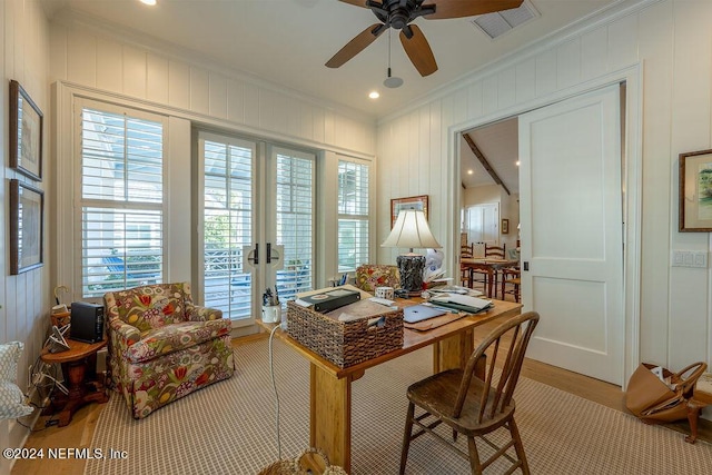 dining area with light hardwood / wood-style flooring, ornamental molding, french doors, and ceiling fan