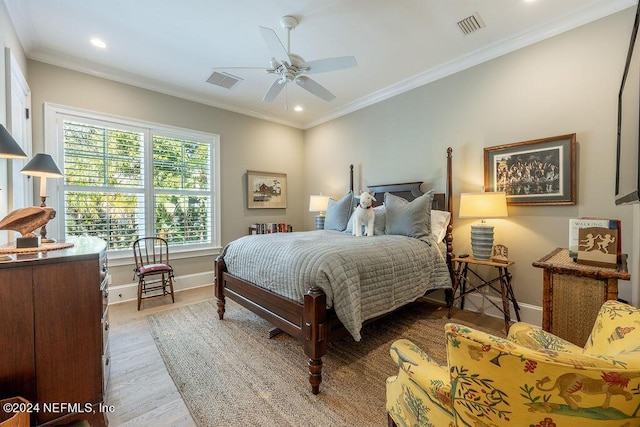 bedroom featuring ceiling fan, ornamental molding, and light hardwood / wood-style floors