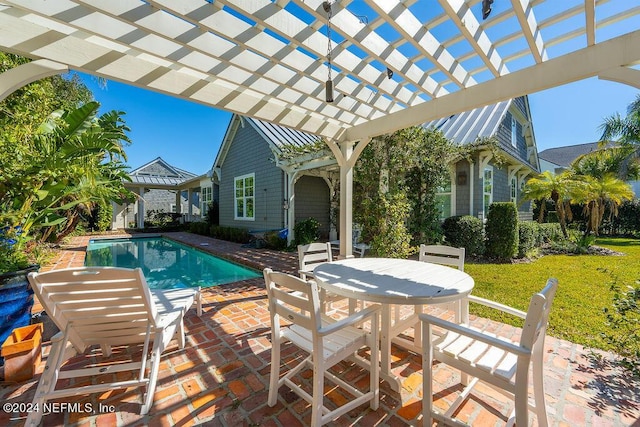 view of pool with a yard, a patio area, and a pergola