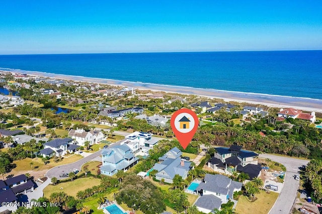 drone / aerial view with a view of the beach and a water view