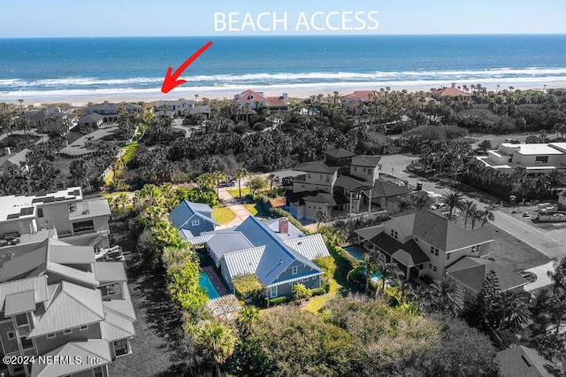 aerial view with a beach view and a water view